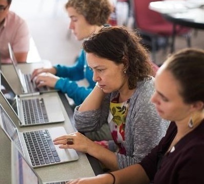 Teachers on computers.jpg